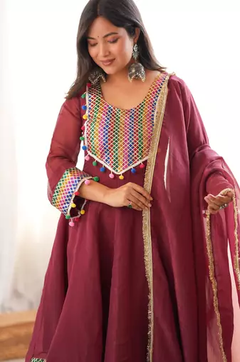  maroon peplum kurti with dhoti salwar and multicolor embroidered border