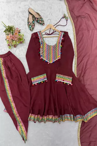  maroon peplum kurti with dhoti salwar and multicolor embroidered border