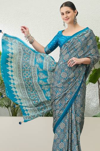 Teal green embroidered ready made saree with blouse fabric