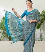 Teal green embroidered ready made saree with blouse fabric