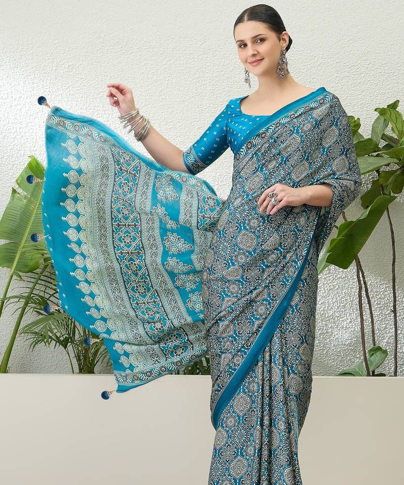 Teal green embroidered ready made saree with blouse fabric