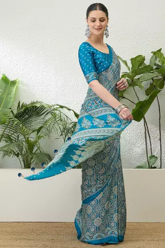 Teal green embroidered ready made saree with blouse fabric