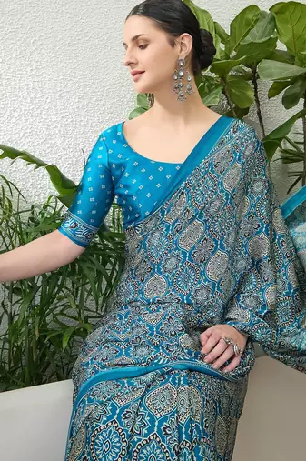 Teal green embroidered ready made saree with blouse fabric
