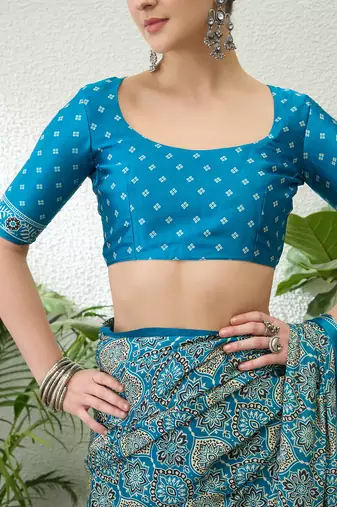 Teal green embroidered ready made saree with blouse fabric