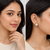 Round pearl cluster stud earrings with ruby, emerald and diamond accents, gold-toned, traditional indian style