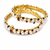 Pearl bangle set with ruby and black stone accents, gold-tone, openable