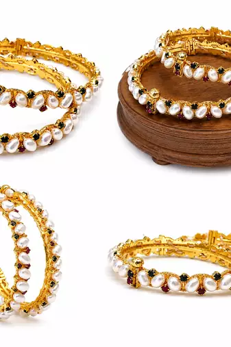Pearl bangle set with ruby and black stone accents, gold-tone, openable