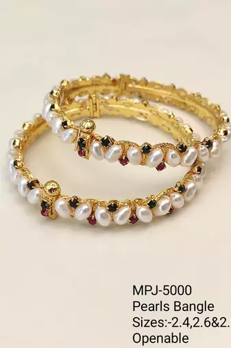 Pearl bangle set with ruby and black stone accents, gold-tone, openable