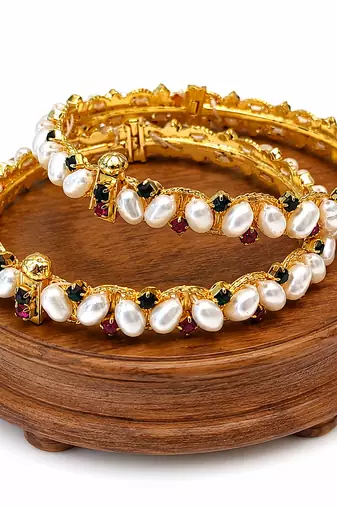 Pearl bangle set with ruby and black stone accents, gold-tone, openable