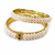 Pearl bangle set with red stone accents, gold-toned, openable, 