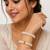 Pearl bangle set with red stone accents, gold-toned, openable, 