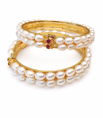 Pearl bangle with ruby accent, gold-toned, double row, openable,