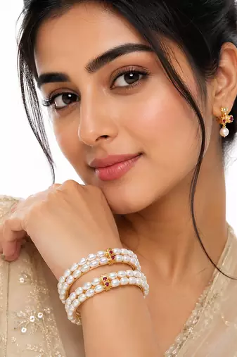 Pearl bangle with ruby accent, gold-toned, double row, openable,