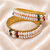 Pearl bangle with ruby and emerald beads, gold-toned, traditional style,