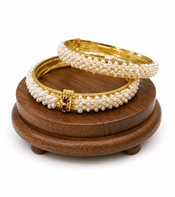 Pearl bangle set with red stone accents, gold-toned, openable,  3