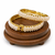 Pearl bangle set with red stone accents, gold-toned, openable, 