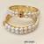 Pearl bangle with ruby accent, gold-toned, double row, openable,