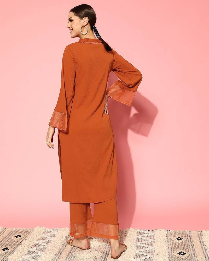 Rust flared sleeve organza detailed v neck textured kurta with palazzo