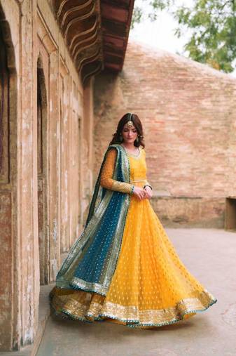 Yellow net thread flared gown set