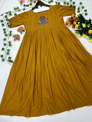 Women's mustard pleated maxi dress with intricate peacock beadwork 2