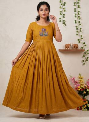 Women's mustard pleated maxi dress with intricate peacock beadwork 1