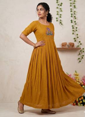 Women's mustard pleated maxi dress with intricate peacock beadwork 3