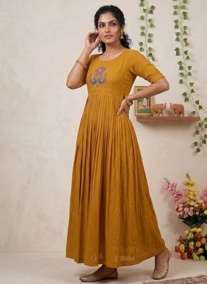 Women's mustard pleated maxi dress with intricate peacock beadwork 4