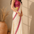cream ready to wear saree with pink floral embroidered border & embroidered stitched blouse.