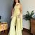 Women's yellow faux georgette embroidered kurti set with palazzo and dupatta
