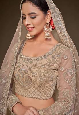 beige net embroidered wedding lehenga choli with free size upto 42 2