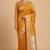 Banarasi semi silk saree in orange colour with  floral zari  work