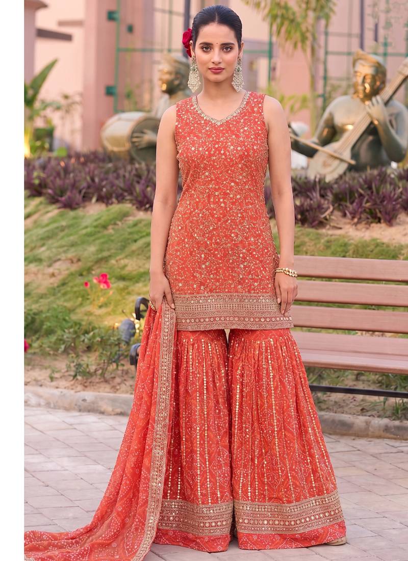 Orange bandhani printed heavy emrboidery worked sharara suit ethnic wear