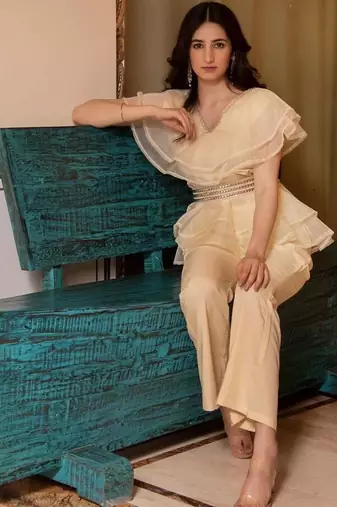 Beige solid georgette v-neck ruffle top & flared pant co-ord set for women