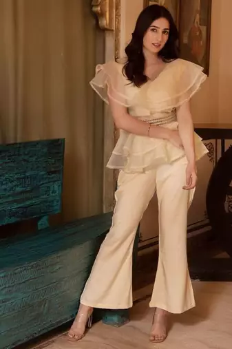 Beige solid georgette v-neck ruffle top & flared pant co-ord set for women