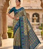 Green patola silk saree with zari weaving meenakari patola design