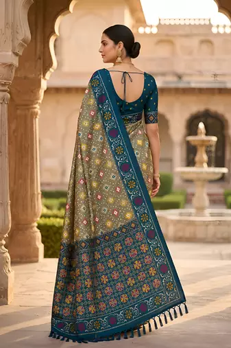 Green patola silk saree with zari weaving meenakari patola design