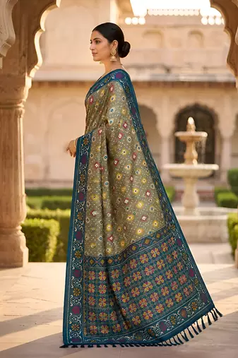 Green patola silk saree with zari weaving meenakari patola design