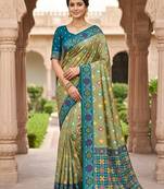 Green patola silk saree with zari weaving meenakari patola design