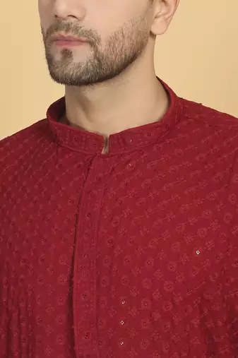 Red color embroidered kurta set with chickenkari work sequins highlights