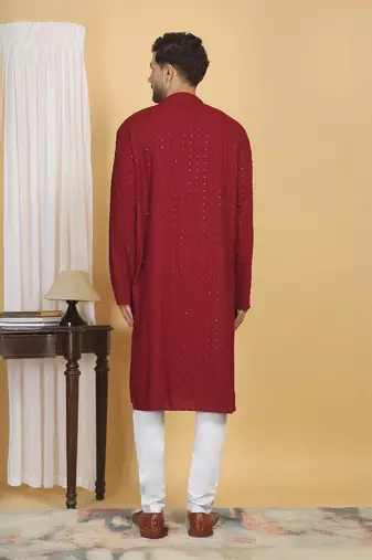 Red color embroidered kurta set with chickenkari work sequins highlights