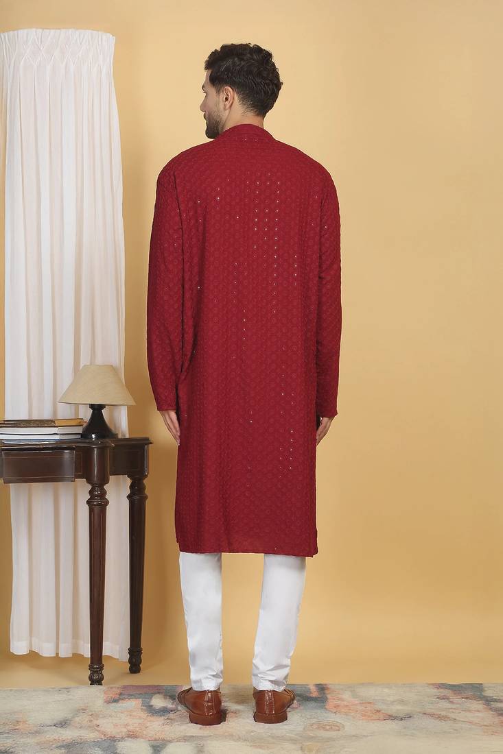 Red color embroidered kurta set with chickenkari work sequins highlights