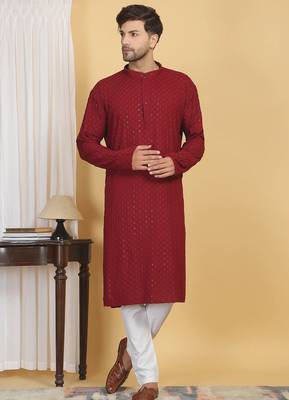 Red color embroidered kurta set with chickenkari work sequins highlights 4