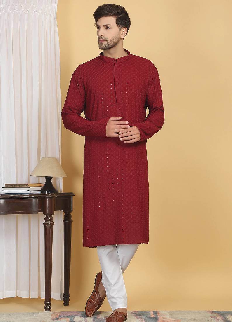 Red color embroidered kurta set with chickenkari work sequins highlights