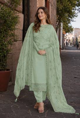 Green heavy natural crepe suit with embroidery & zarkhan work 1