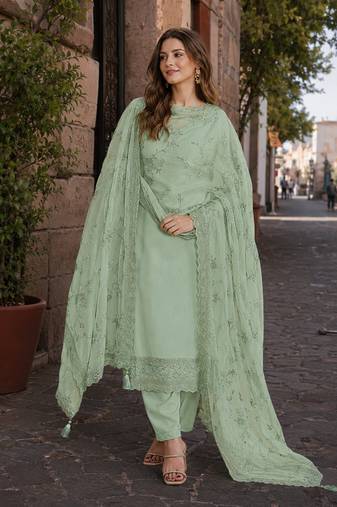 Green heavy natural crepe suit with embroidery & zarkhan work