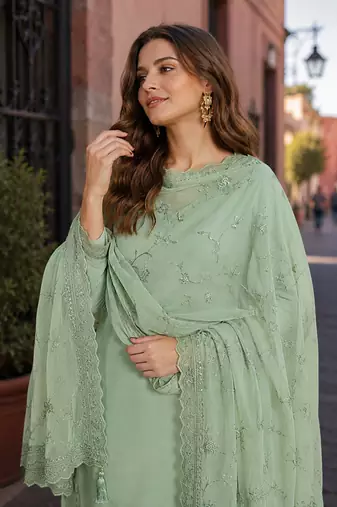 Green heavy natural crepe semi stitched suit with embroidery & zarkhan work