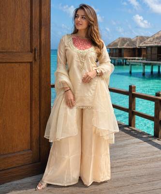 Cream roman shimmer kurti set with handwork & moti work 1