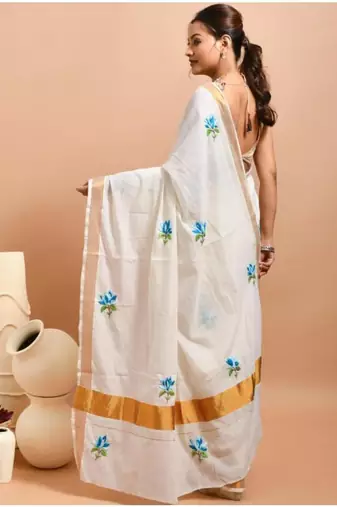off white kasavu saree with hand embroidered blue lotus designs 