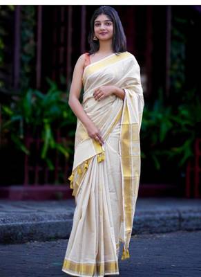 off white zari tissue kasavu saree with golden tassels 1