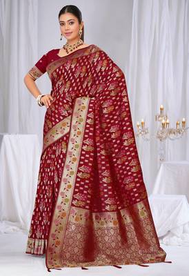 Dusty mauve raw silk saree with zari and floral thread work with tassels 1